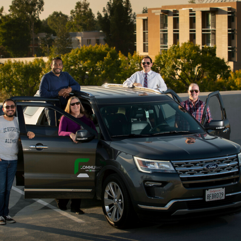 Group of people with an SUV