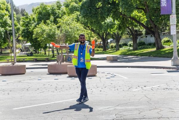 TAPS employee directing traffic