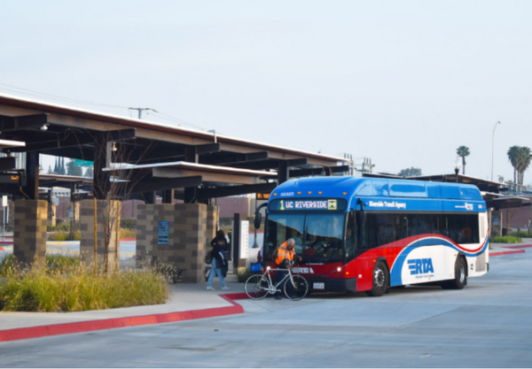 Passengers boarding the RTA Route 1 bus at the Vine Mobility Hub in Downtown Riverside.
